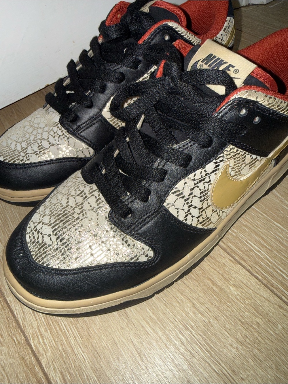 Nike Dunks Low Top Sneakers in Black & Gold | women’s 8